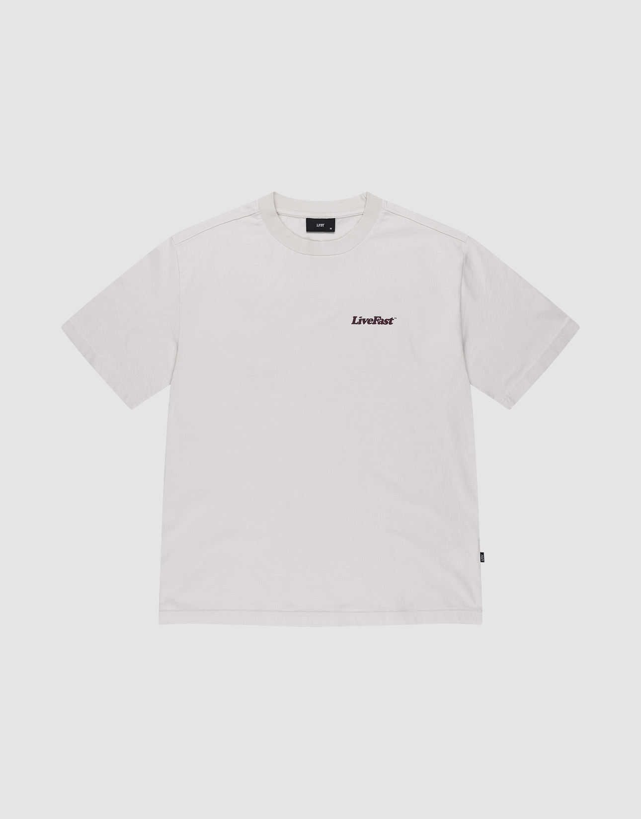 The Basic 210 Tee by LIVE FAST DIE YOUNG is a plain white short-sleeve crew neck t-shirt made from 100% Baumwolle, featuring small black "LiveFast" text on the left chest with no other designs or patterns.