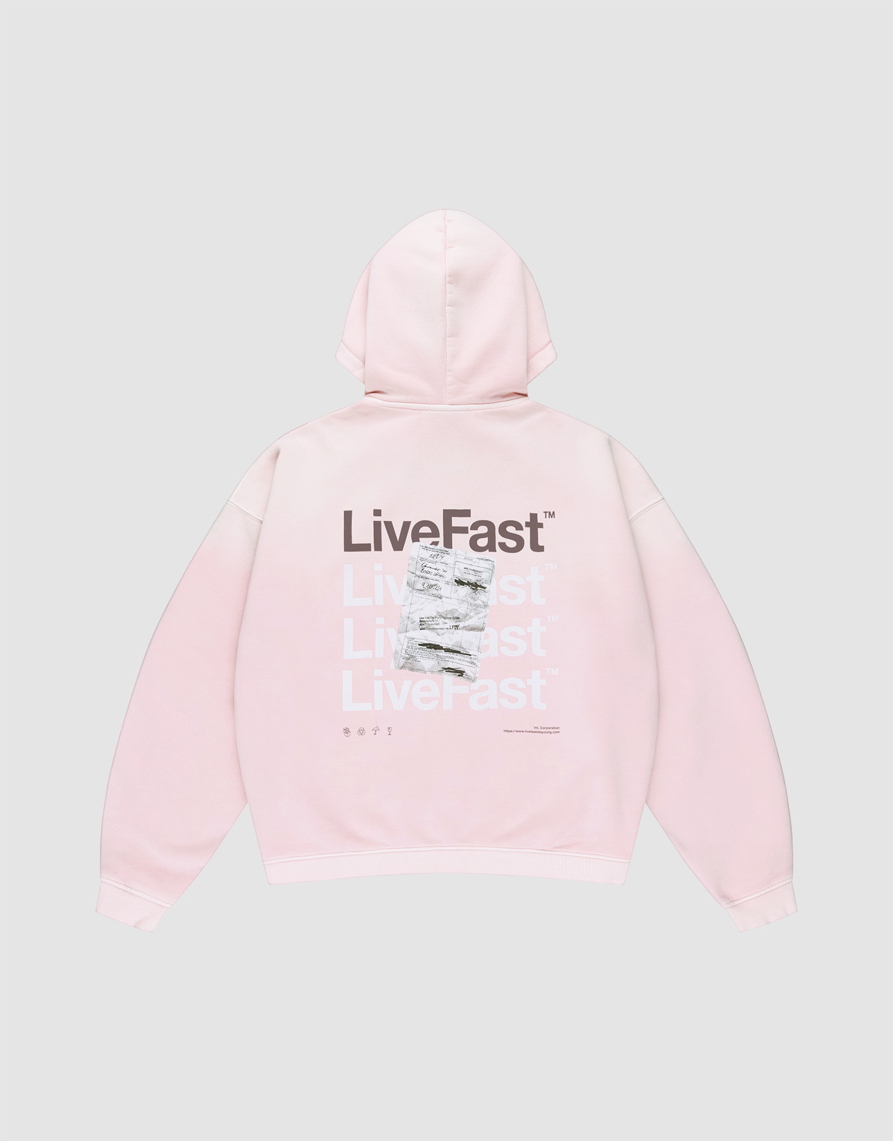 The Basic Evidence Hooded Zip by LIVE FAST DIE YOUNG is a light pink oversized hoodie with “LiveFast” in white and gray on the back, black “LiveFast” at the top, LFDY branding, and a crumpled graphic layered over part of the text.