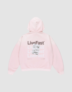The Basic Evidence Hooded Zip by LIVE FAST DIE YOUNG is a light pink oversized hoodie with “LiveFast” in white and gray on the back, black “LiveFast” at the top, LFDY branding, and a crumpled graphic layered over part of the text. | plain