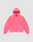 The LIVE FAST DIE YOUNG "Basic Hooded Zip" is a bright pink, oversize-fit zip-up hoodie with front pockets, a hood, and subtle white branding on the left chest, shown against a plain light gray background.