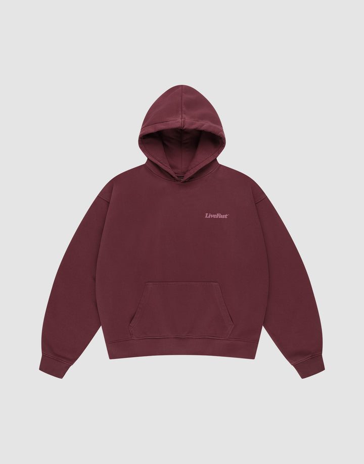 The Basic 360 Hooded by LIVE FAST DIE YOUNG is a maroon cotton hoodie with a front pocket, small "LiveFast" text on the left chest, and an oversize fit, shown against a plain light gray background.