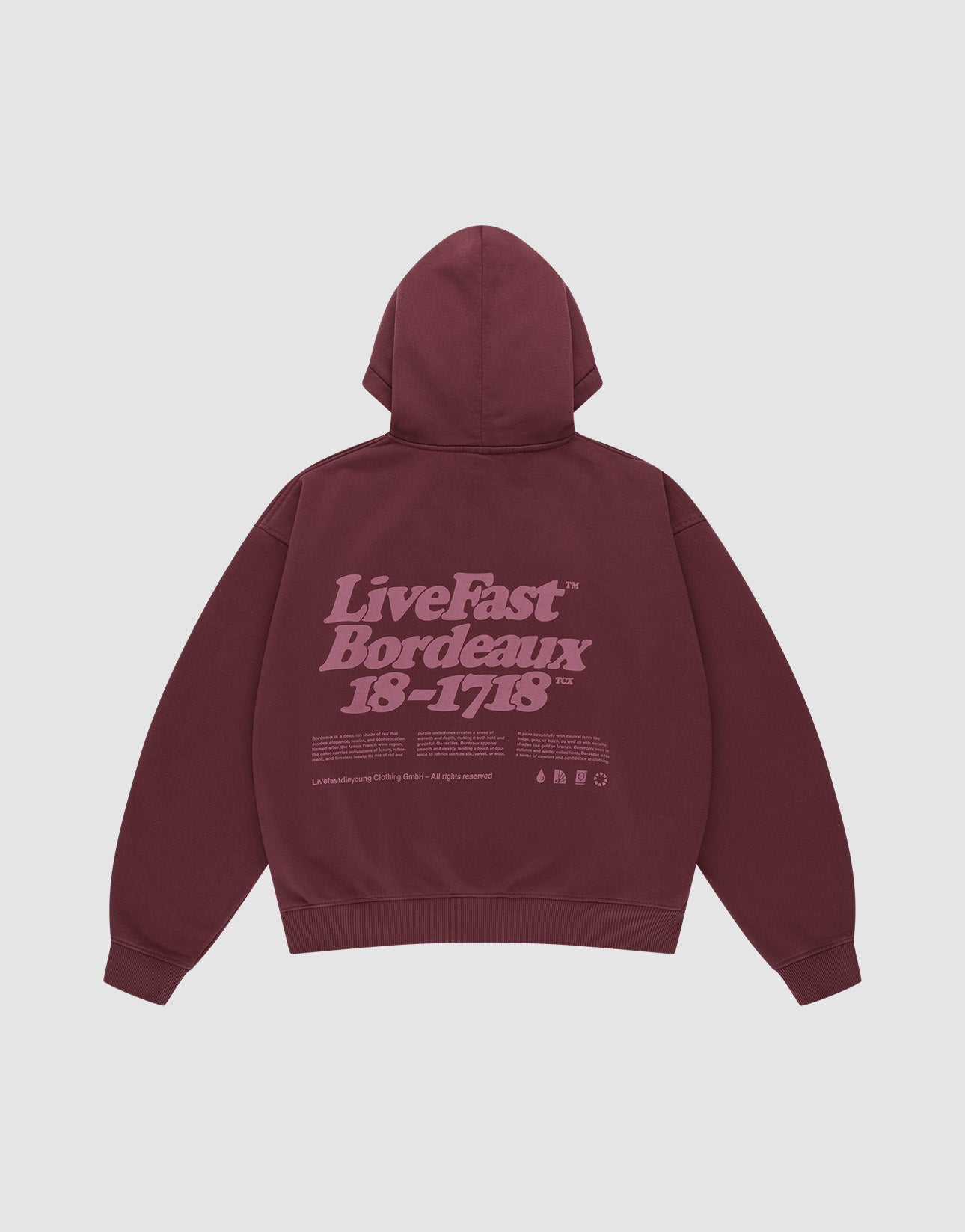 The LIVE FAST DIE YOUNG Basic 360 Hooded is a maroon oversized cotton hoodie with a hood, front and back prints including a large light purple "LiveFast Bordeaux 18-1718" text and small symbols on the back.