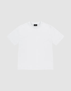 The LIVE FAST DIE YOUNG Basic Heavy Tee, an oversized white short-sleeved shirt made from 100% Baumwolle, is shown laid flat on a light gray background and viewed from the front. | plain
