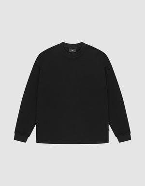 The LIVE FAST DIE YOUNG Blank Waffle Longsleeve, a black oversized crewneck sweatshirt made from 100% Baumwolle, features Ripp-Bündchen at the cuffs and neckline and is shown laid flat on a light gray background. | plain