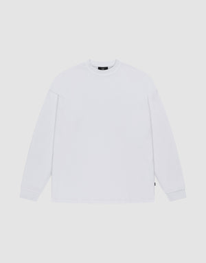 The LIVE FAST DIE YOUNG Blank Waffle Longsleeve, in Oversize Fit, is a plain white crew neck shirt with simple ribbed cuffs, made from 100% Baumwolle and featuring a minimal design without visible logos or patterns. | plain