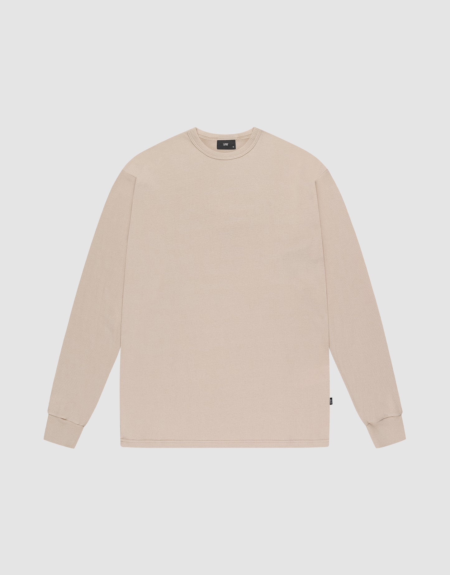The LIVE FAST DIE YOUNG Basic Regular Rib Longsleeve in plain beige features a crewneck, long sleeves, regular fit, and ribbed cuffs, shown laid flat on a white background.
