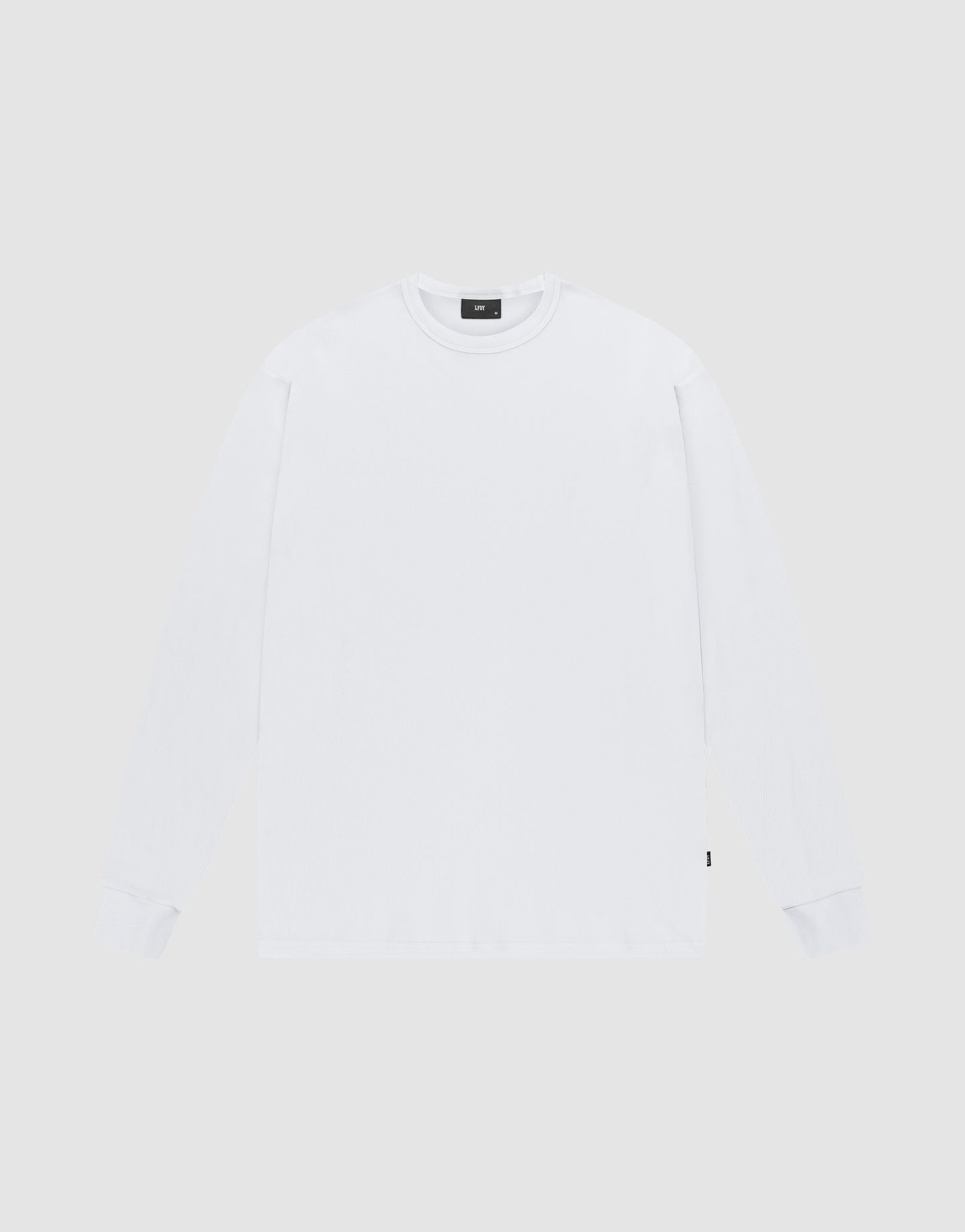 The LIVE FAST DIE YOUNG Basic Regular Rib Longsleeve is a plain white, regular-fit crew neck shirt with fine ribbed cuffs, shown laid flat on a light gray background.