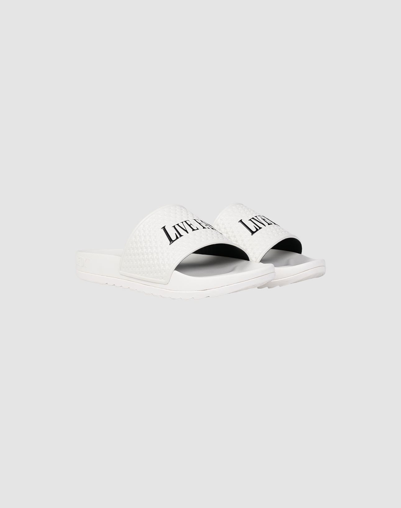 A pair of white LFDY Slides by LIVE FAST DIE YOUNG featuring a textured PU strap with "LIVERPOOL" printed in black, shown on a plain light gray background.