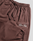The Wide Cuff Jogger by LIVE FAST DIE YOUNG features a maroon wide fit with an elastic waistband, drawstrings, side pockets, and white "Live Fast Stay Young" print on the thigh. Made from soft French Terry for comfort.