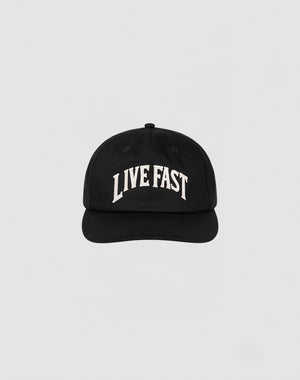 The Live Fast Unstructured Cap by LIVE FAST DIE YOUNG is a black baseball cap featuring a Flag Label and bold white LIVE FAST Logo-Stick embroidery on the front, shown against a plain light gray background.