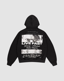 The LFDY Cinema Hooded by LIVE FAST DIE YOUNG is an oversized black cotton hoodie with intense eyes and "LIVE FAST" printed on the front, plus Germany, Netherlands, United Kingdom text and a cityscape image on the back. | plain