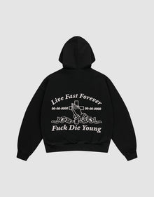 The LFDY Praying Hooded Zip by LIVE FAST DIE YOUNG is a black oversized hoodie with bold white “Live Fast Forever and Fuck Die Young” text, cross, numbers, and rose-holding hands graphic on the back, plus a subtle distress effect. | plain