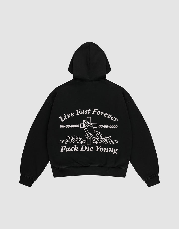 The LFDY Praying Hooded Zip by LIVE FAST DIE YOUNG is a black oversized hoodie with bold white “Live Fast Forever and Fuck Die Young” text, cross, numbers, and rose-holding hands graphic on the back, plus a subtle distress effect. | plain