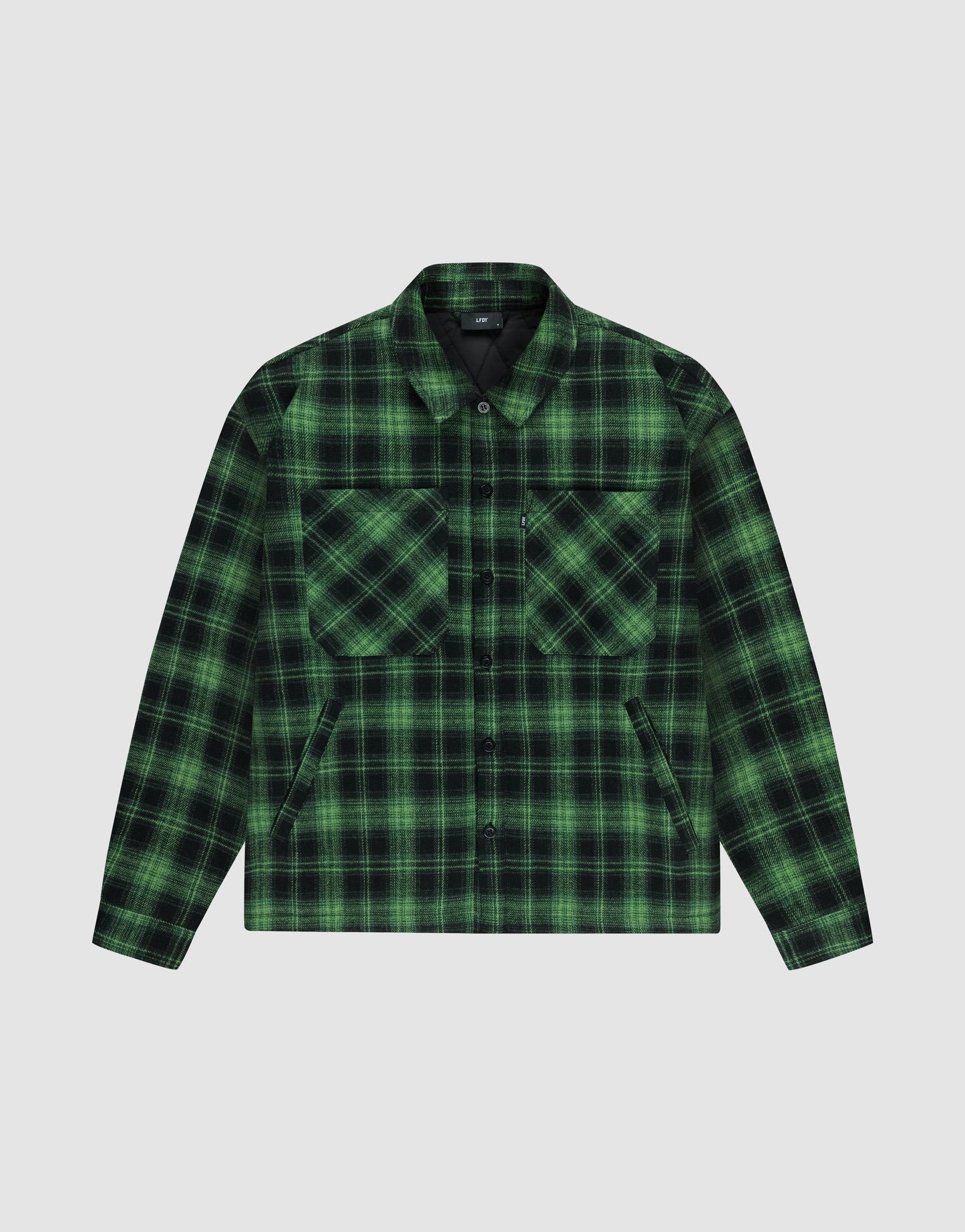 The LFDY Padded Flannel by LIVE FAST DIE YOUNG features a green and black plaid pattern, oversize fit, collar, button-down front, and two chest pockets, shown laid flat on a light gray background.