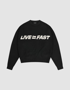 The Live Fast Boucle Sweater by LIVE FAST DIE YOUNG is a black oversized crewneck with "LIVE FAST" in bold white lettering across the chest. | plain