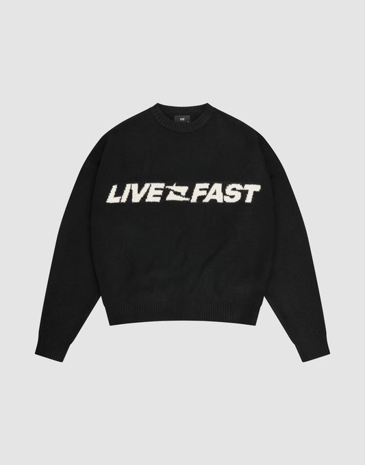 The Live Fast Boucle Sweater by LIVE FAST DIE YOUNG is a black oversized crewneck with "LIVE FAST" in bold white lettering across the chest. | plain