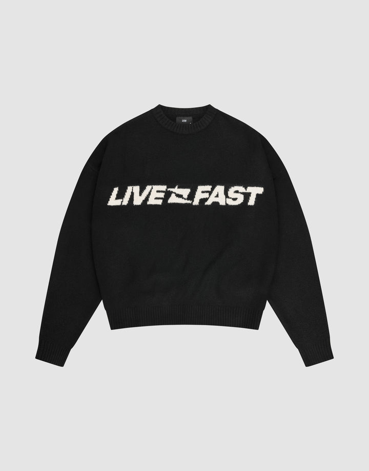 The Live Fast Boucle Sweater by LIVE FAST DIE YOUNG is a black oversized crewneck with "LIVE FAST" in bold white lettering across the chest. | plain