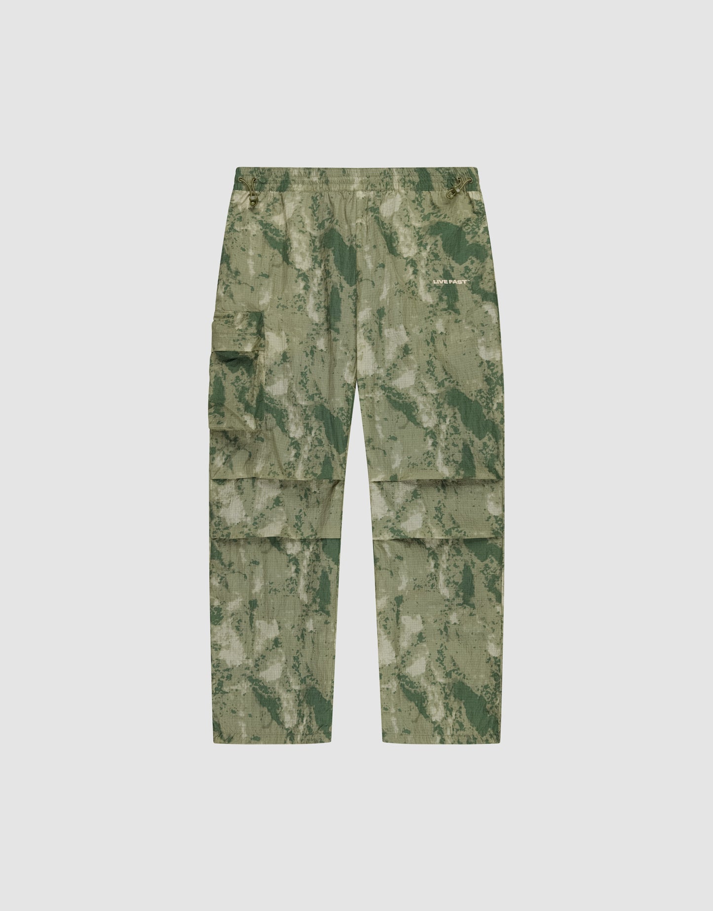 LIVE FAST DIE YOUNG Live Fast Nylon Pants in green camouflage, featuring an oversize fit, multiple cargo pockets, elastic waistband, and zipper, shown flat on a plain light background.
