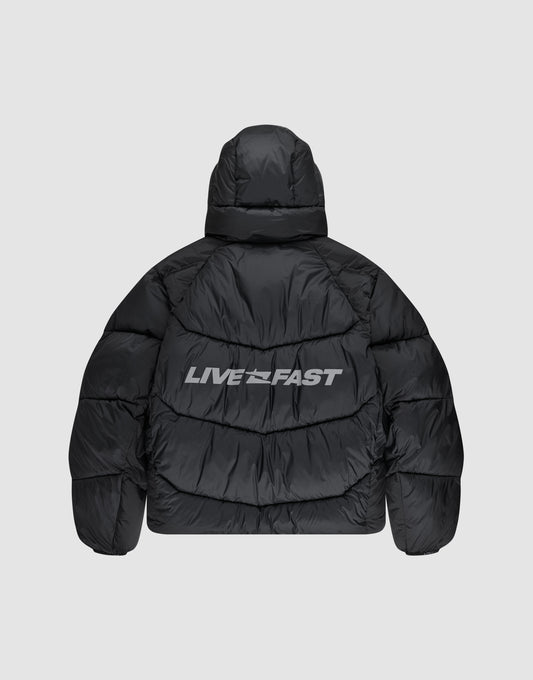 The Live Fast Puffer Jacket by LIVE FAST DIE YOUNG features a black oversize fit, hood, and bold white "LIVE FAST" reflektierender Print across the upper back for standout style.