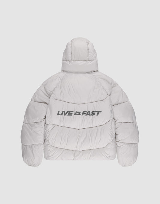 The Live Fast Puffer Jacket by LIVE FAST DIE YOUNG is a light gray, hooded jacket shown from the back with a reflective LIVE FAST print in bold black letters across the back.