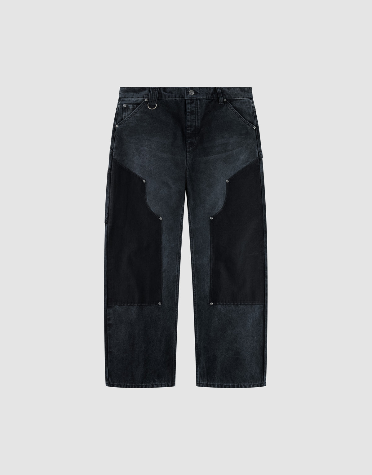 The LFDY Carpenter Pants by LIVE FAST DIE YOUNG feature a wide-leg, high-waist black denim design with dark charcoal thigh patches, silver rivet details, and are made from 100% Baumwolle. Shown on a light gray background. | plain