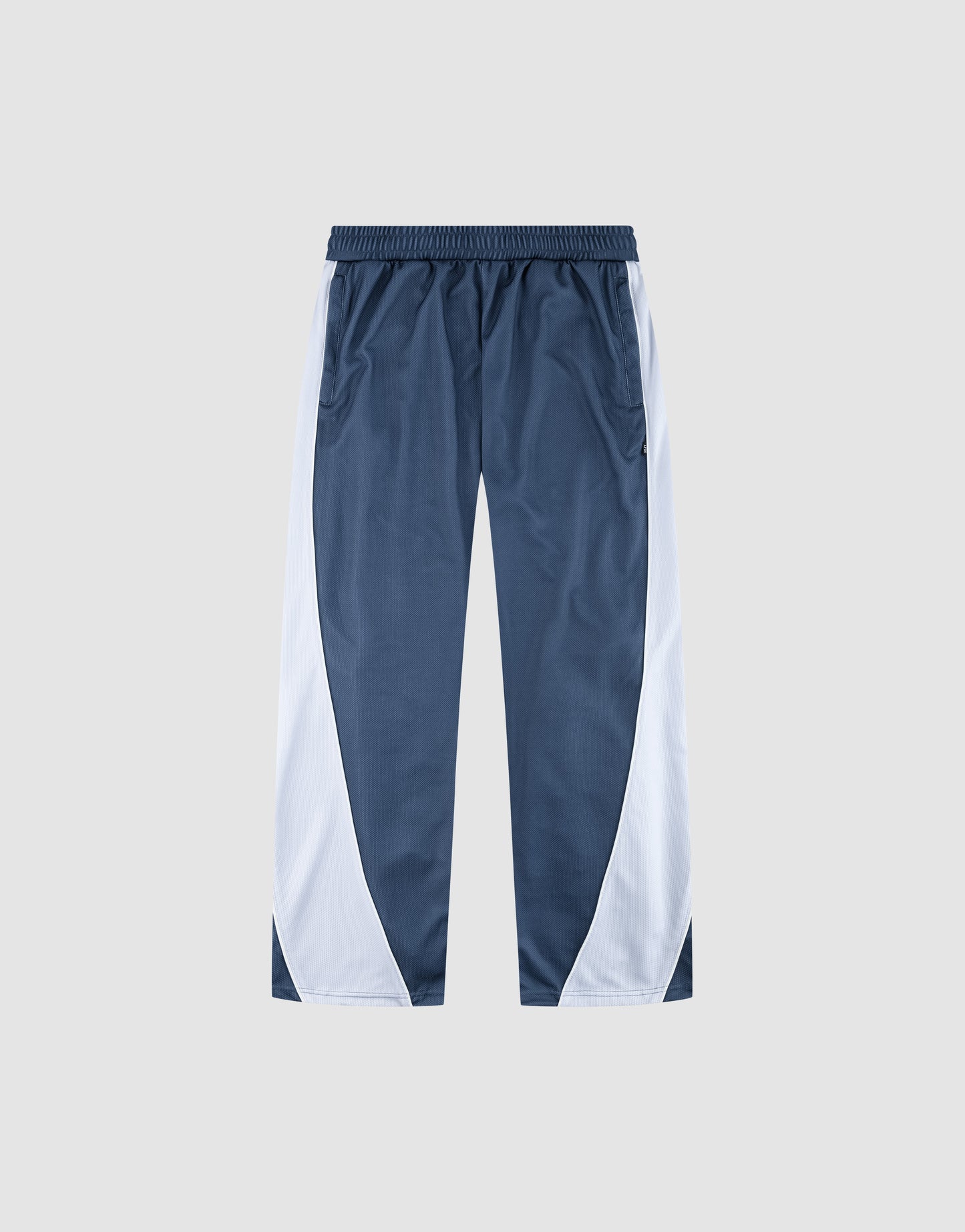 LFDY DY Trackpants by LIVE FAST DIE YOUNG: blue with Stick Patch detail, white curved side panels, elastic waistband, wide fit straight legs. Shown on a plain light gray background.