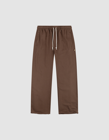 The LFDY Lightweight Jogger by LIVE FAST DIE YOUNG features a wide fit, straight-leg design in brown French Terry with an elastic waistband, white drawstring, and side pockets. Shown flat on a plain light background. | plain