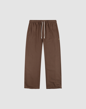 The LFDY Lightweight Jogger by LIVE FAST DIE YOUNG features a wide fit, straight-leg design in brown French Terry with an elastic waistband, white drawstring, and side pockets. Shown flat on a plain light background. | plain