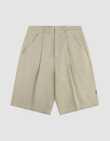 The LFDY Twill Shorts by LIVE FAST DIE YOUNG feature a beige color, front pleats, wide straight legs, belt loops, side pockets, and a relaxed oversized fit, shown on a plain white background. | plain