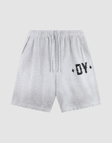 The DY Rivet Shorts by LIVE FAST DIE YOUNG feature a light gray color, elastic waistband with drawstring, side pockets, and black DY lettering with diamond accents. Made from 100% Baumwolle in an Oversize Fit for maximum comfort. | plain