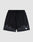 LIVE FAST DIE YOUNG Burning Mesh Shorts: black athletic shorts with elastic waistband, drawstring, gray flame print along the bottom, and a small white rectangular patch on the left leg. Plain light gray background.