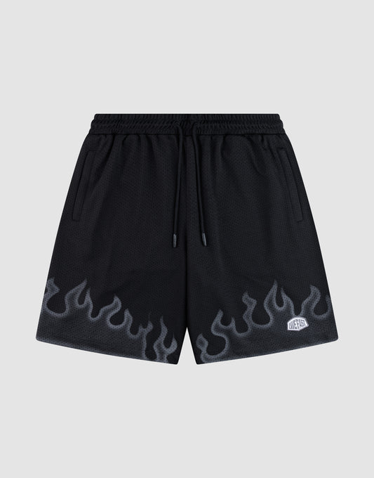 LIVE FAST DIE YOUNG Burning Mesh Shorts: black athletic shorts with elastic waistband, drawstring, gray flame print along the bottom, and a small white rectangular patch on the left leg. Plain light gray background. | plain