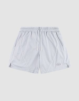 The LFDY Piping Mesh Shorts by LIVE FAST DIE YOUNG feature light gray polyester mesh, an elastic waistband with white drawstring, side pockets, front seam piping, a logo patch on the lower left leg, and a regular fit. Background is plain light gray. | plain
