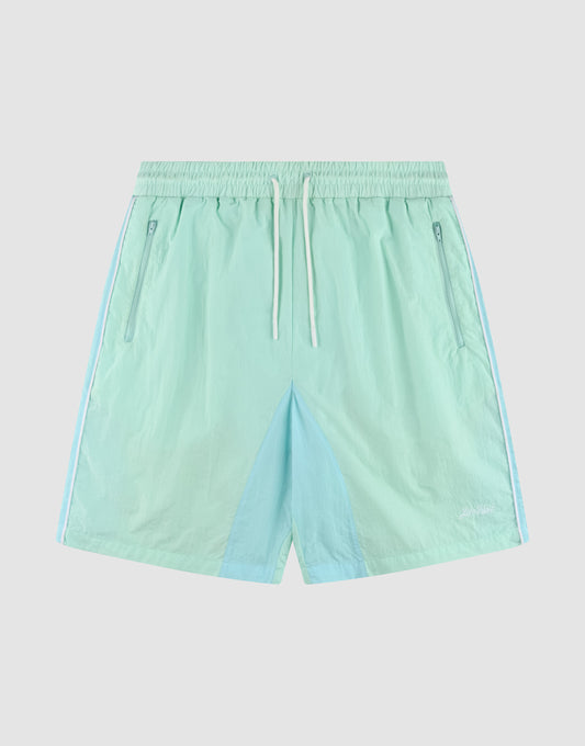 LIVE FAST DIE YOUNG Beach Shorts in light blue and mint green, color-blocked with elastic waistband, white drawstring, side zip pockets, and a small white logo on the lower left leg. Regular fit. Laid flat on a white background. | plain