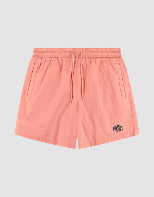 The Live Fast Swim Shorts by LIVE FAST DIE YOUNG feature a light pink color, Elastikbund, adjustable drawstring, side pockets, and a black and white patch logo on the left leg in Regular Fit, shown on a light gray background. | plain