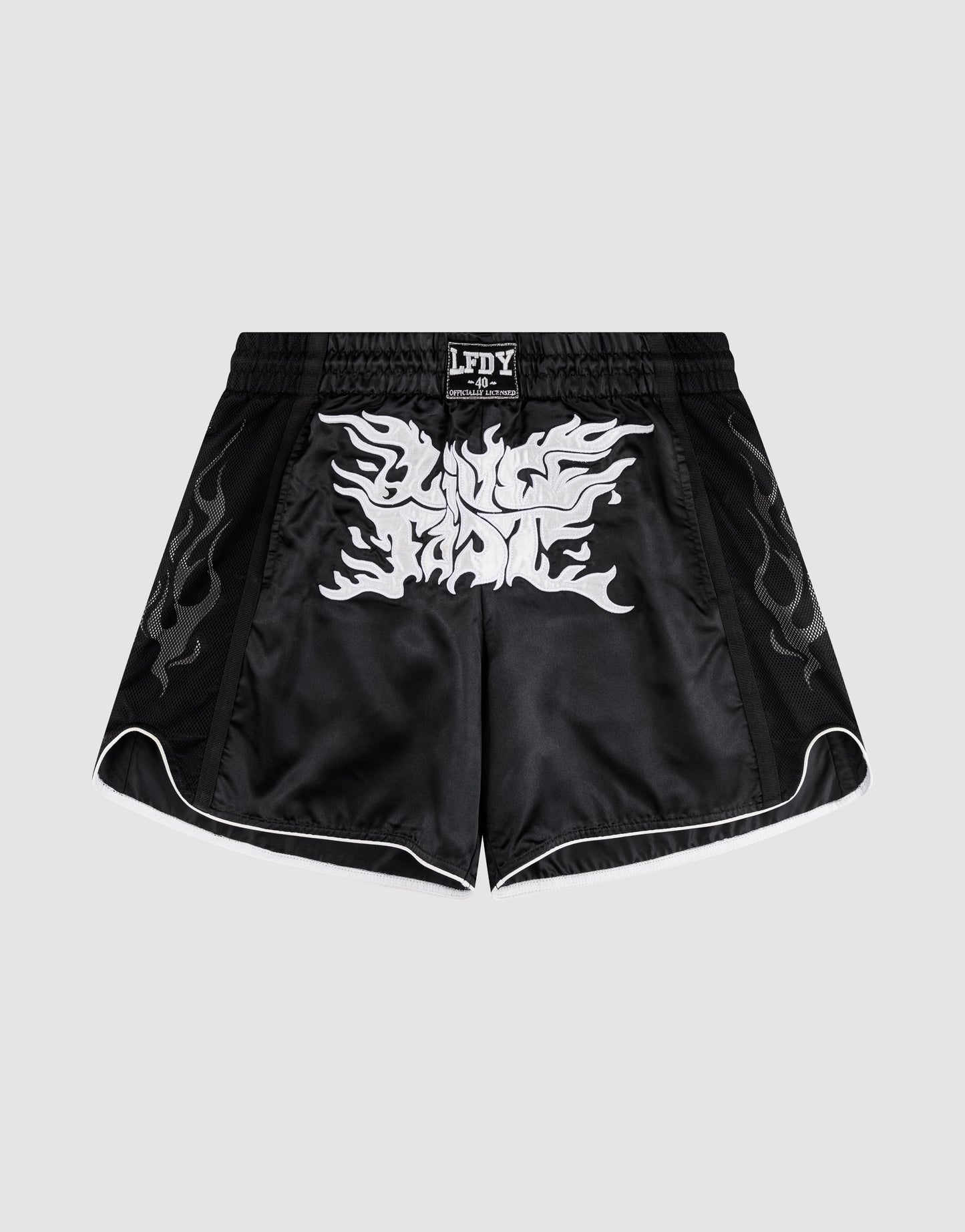 LFDY Fighting Shorts by LIVE FAST DIE YOUNG feature black polyester fabric, silver flame patterns on the sides, a bold white front graphic, breiter Elastikbund, and seitliche Eingrifftaschen for extra function.