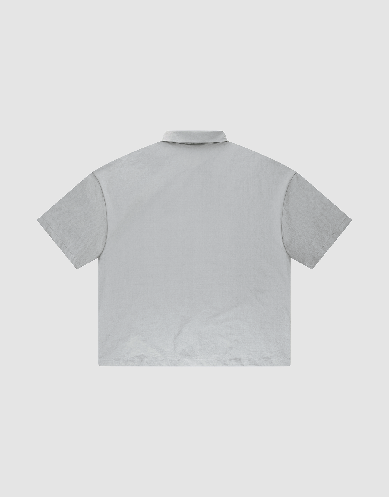 The LFDY Ripstop Shirt by LIVE FAST DIE YOUNG features a plain, light gray design with an oversized fit, shown from the back against a white background.
