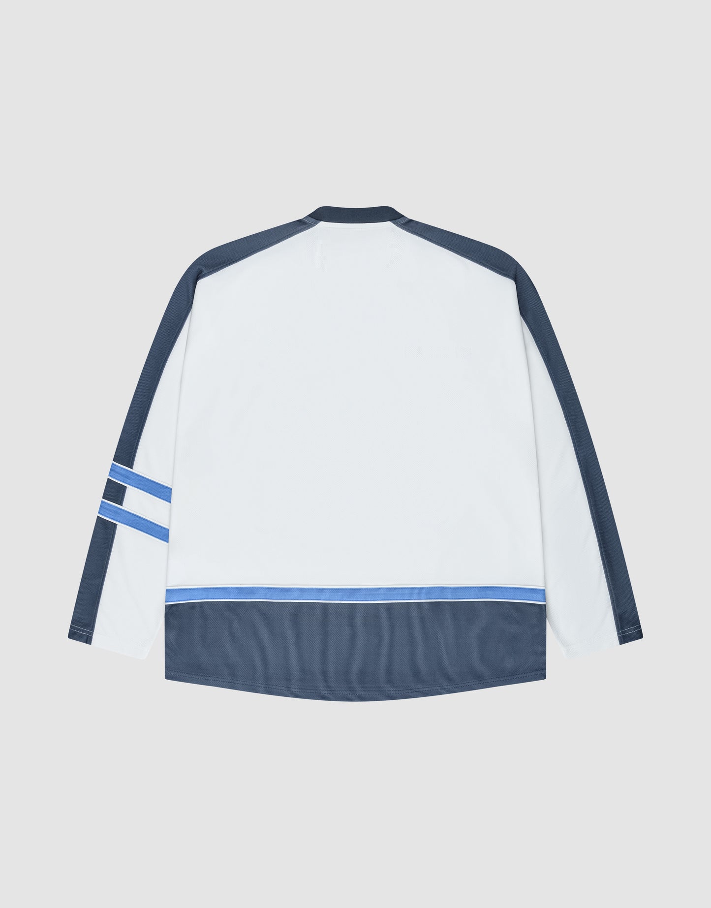 The LFDY Flames Jersey by LIVE FAST DIE YOUNG features an oversized fit with a white back, navy sleeves and hem, plus light blue and navy stripes. Made from polyester, it's shown laid flat on a light gray background.
