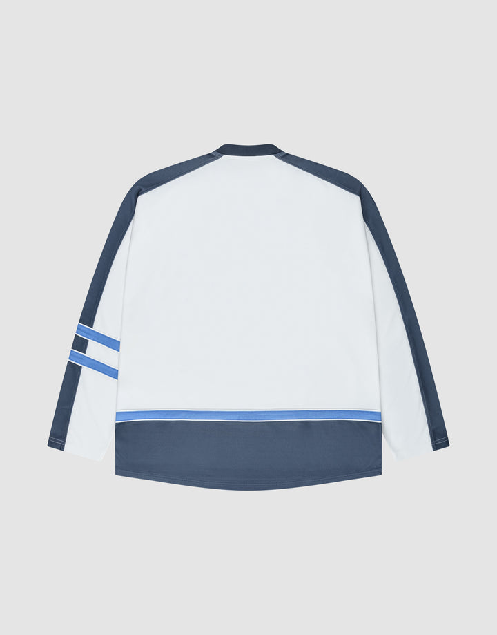 The LFDY Flames Jersey by LIVE FAST DIE YOUNG features an oversized fit with a white back, navy sleeves and hem, plus light blue and navy stripes. Made from polyester, it's shown laid flat on a light gray background.