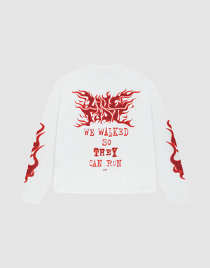 The LFDY We Walked Longsleeve by LIVE FAST DIE YOUNG is a white, 100% Baumwolle oversize-fit shirt with red flame graphics on the sleeves and back, plus bold WE WALKED SO THEY CAN RUN text on the upper back. | plain