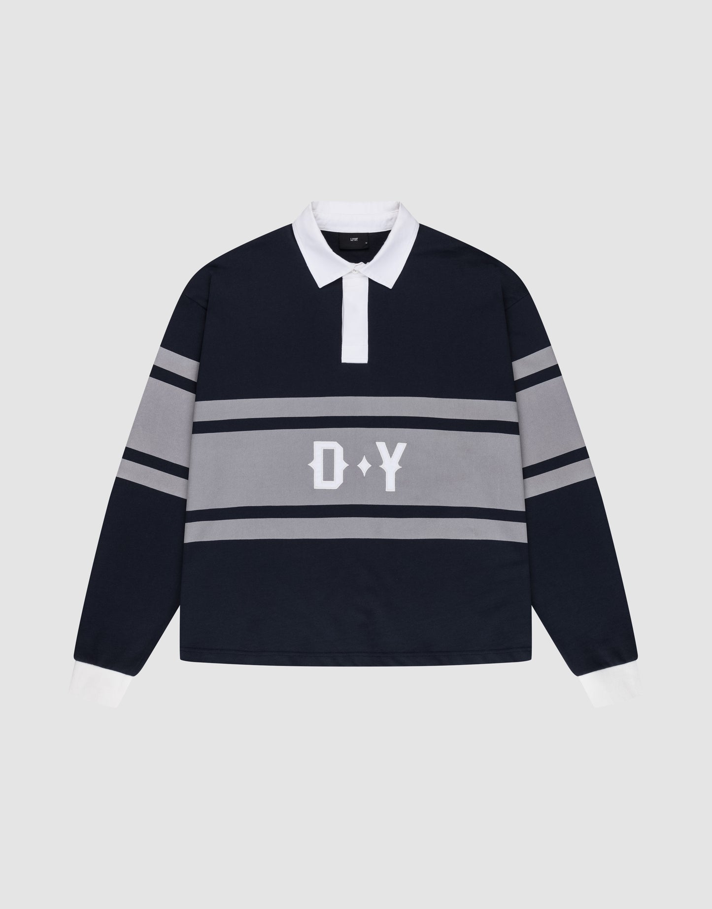 The LFDY Striped Polo by LIVE FAST DIE YOUNG is a navy blue and gray rugby shirt with an oversize fit, white collar and cuffs, horizontal gray stripes, and bold white D Y lettering on the front. Laid flat on a light gray background.
