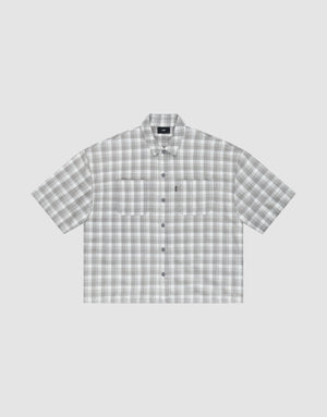 The LIVE FAST DIE YOUNG LFDY Light Flannel is an oversize fit, short-sleeved button-up with gray and white plaid, two chest pockets, and a pointed collar, shown on a plain light background. | plain