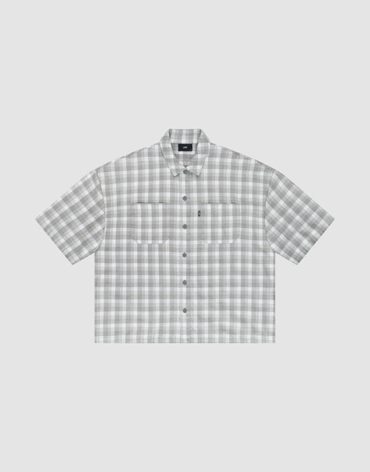 The LIVE FAST DIE YOUNG LFDY Light Flannel is an oversize fit, short-sleeved button-up with gray and white plaid, two chest pockets, and a pointed collar, shown on a plain light background. | plain