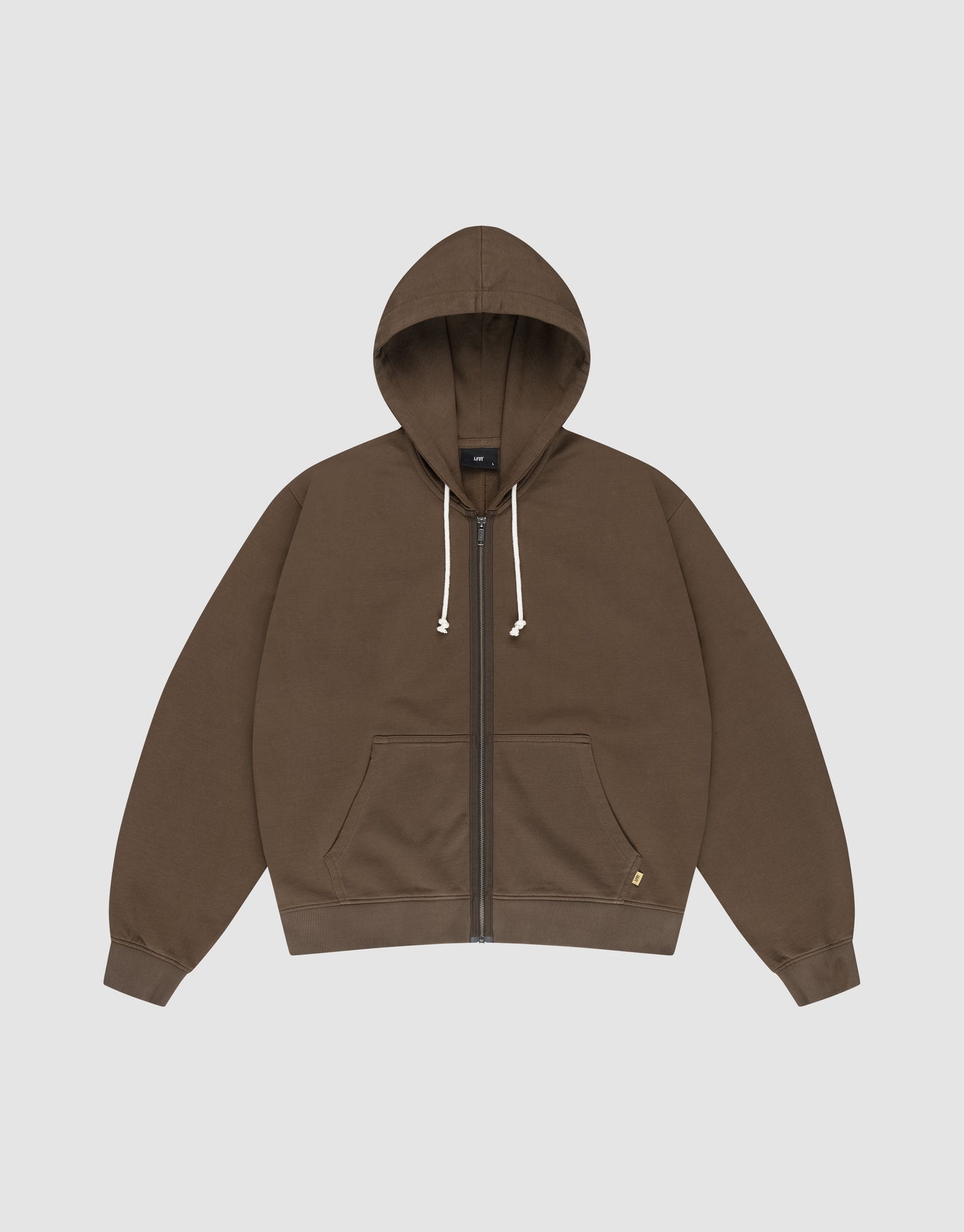 The LFDY Lightweight Hooded Zip by LIVE FAST DIE YOUNG is a brown French Terry regular-fit hoodie with a zip-up front, white drawstrings, front pocket, and a small tag near the hem, shown laid flat on a light background.