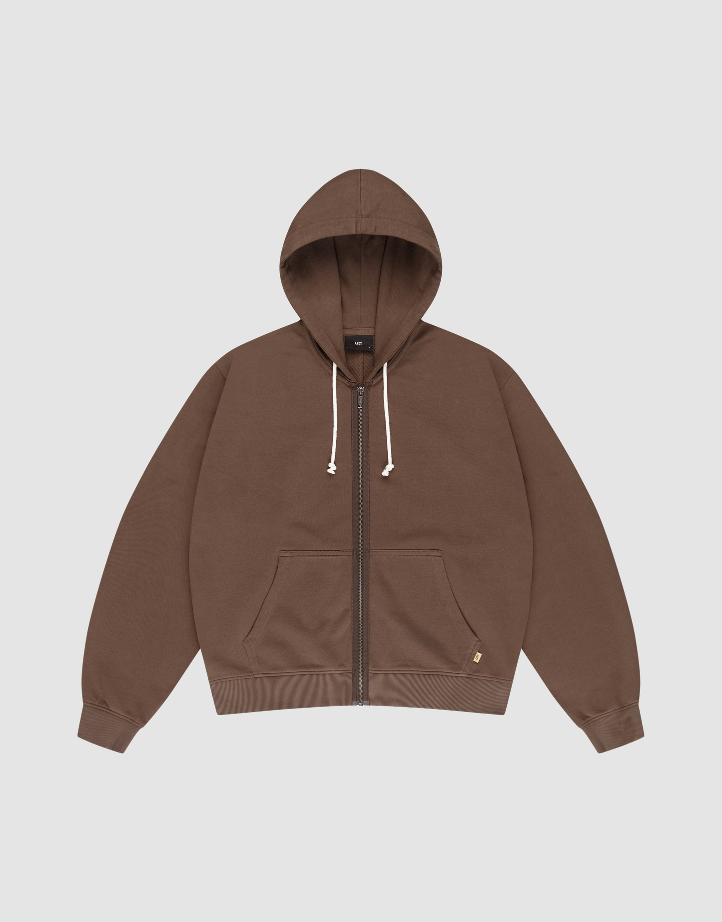 The LFDY Lightweight Hooded Zip by LIVE FAST DIE YOUNG is a brown, regular-fit zip-up hoodie with a front pocket, white drawstrings, and a small gold tag near the pocket, made from soft French Terry fabric on a light background.