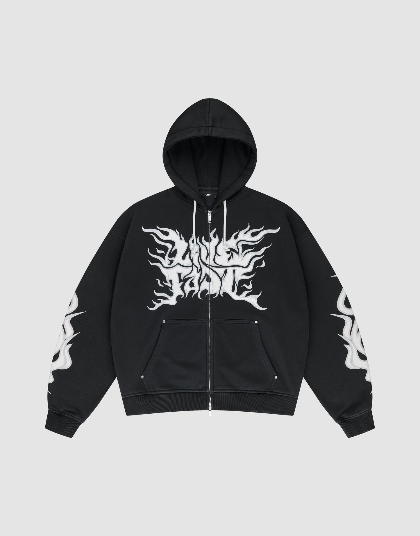 The LIVE FAST DIE YOUNG LFDY Inferno Hooded Zip is a black oversized zip-up hoodie with drawstring hood and front pockets, featuring bold white flame graphics on chest and sleeves, shown against a plain gray background.