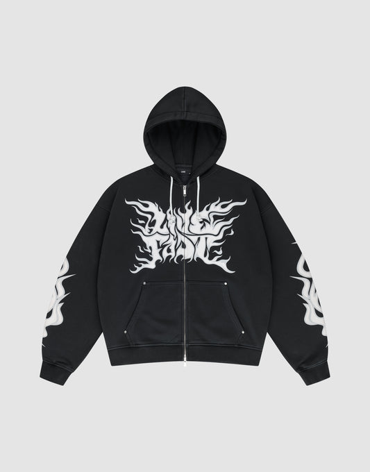 The LIVE FAST DIE YOUNG LFDY Inferno Hooded Zip is a black oversized zip-up hoodie with drawstring hood and front pockets, featuring bold white flame graphics on chest and sleeves, shown against a plain gray background. | plain