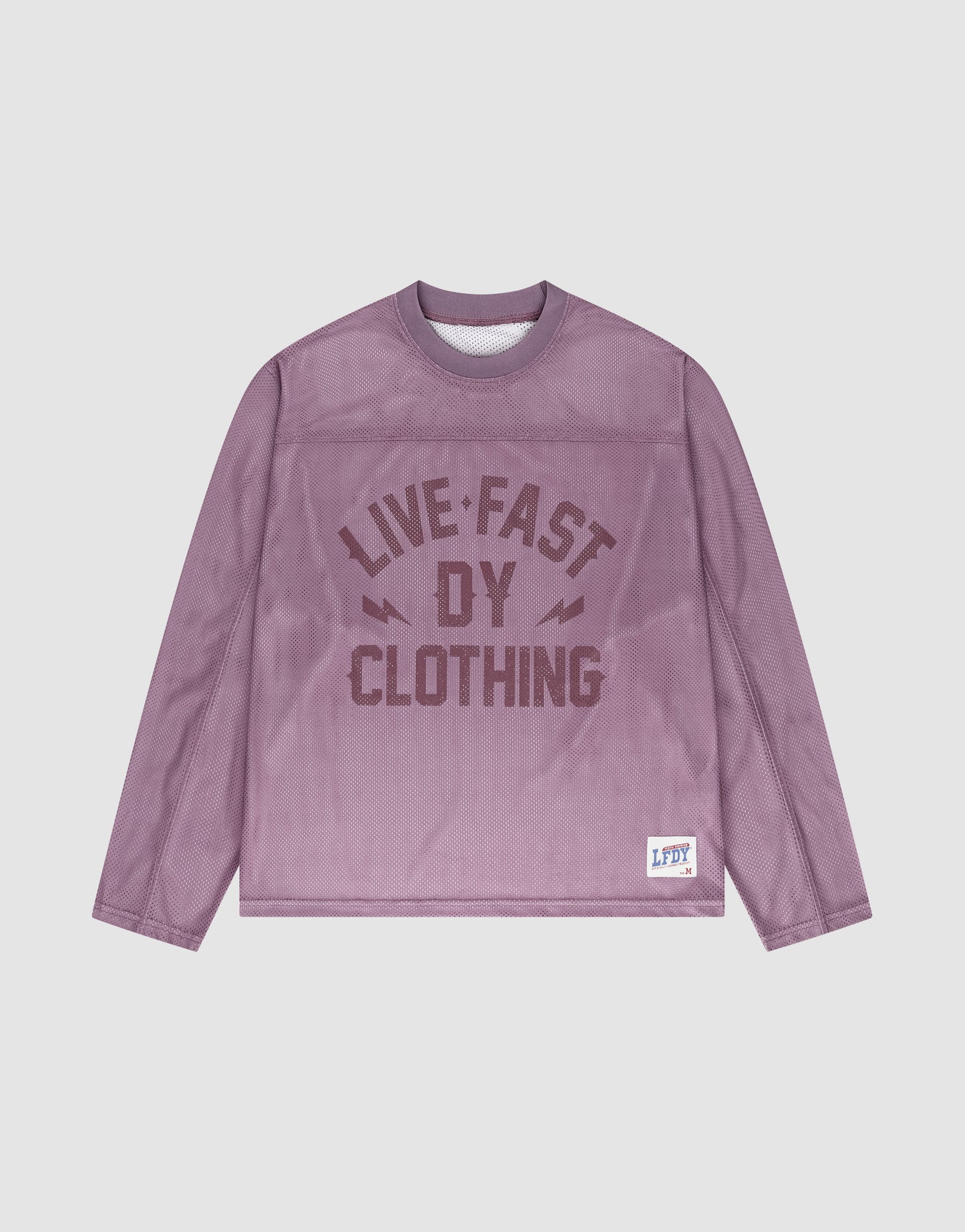 The LFDY Flash Jersey by LIVE FAST DIE YOUNG is a purple mesh, long-sleeve shirt with an oversized fit, bold front branding, and a small LFDY label on the lower left hem.