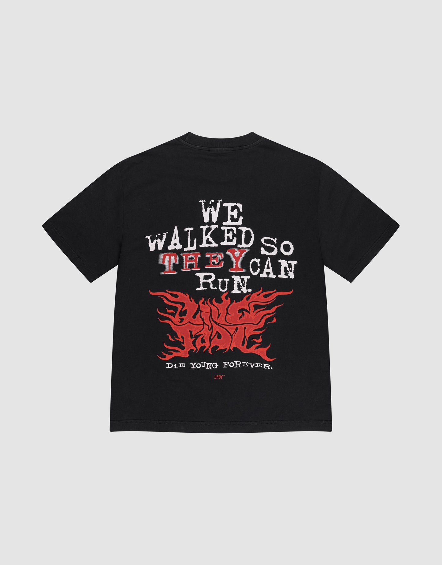 The LFDY We Walked Tee by LIVE FAST DIE YOUNG features an oversized cotton fit, "WE WALKED SO THEY CAN RUN" in white and red, a bold red flame graphic, and "DIE YOUNG FOREVER" backprint.
