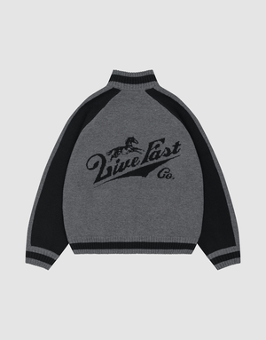 The Boxy Knit Zip Jacket by LIVE FAST DIE YOUNG features gray and black intarsia-knit with dark raglan sleeves, a running horse graphic, “Live Fast Co.” on the back, and ribbed cuffs, hem, and collar for an oversize fit.| plain